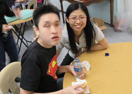 Volunteer chatting blind people